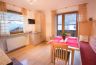 Kitchen with Flat-TV and entrance to the balcony